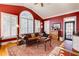 Comfortable sitting room with a vaulted ceiling, a leather sofa, an area rug, and bright, natural light at 195 High Bluff Ct, Duluth, GA 30097