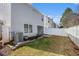 Grassy backyard featuring white fencing providing ample privacy for outdoor enjoyment at 5545 Mountain Top Pl, Cumming, GA 30041