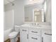 Bathroom with white cabinets, a tub and shower combo, and modern fixtures at 5545 Mountain Top Pl, Cumming, GA 30041