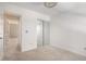 Bedroom with neutral carpet, and mirrored closet doors providing ample storage space at 5545 Mountain Top Pl, Cumming, GA 30041