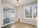 Cozy dining area with sliding glass doors to the patio and a large window for natural light at 5545 Mountain Top Pl, Cumming, GA 30041