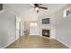 Cozy living room featuring a fireplace, hardwood floors, and neutral paint at 5545 Mountain Top Pl, Cumming, GA 30041