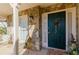 Inviting front porch with beautiful stone and a festive holiday wreath on the entryway door at 1088 Raleigh Way, Lawrenceville, GA 30043