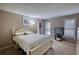 Bright bedroom with a large bed, soft carpet, and plenty of natural light from the windows at 744 Hampton Locust Grove Rd, Hampton, GA 30228