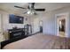 Bedroom with a mounted TV and black fireplace at 744 Hampton Locust Grove Rd, Hampton, GA 30228