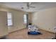 Bedroom with windows and a ceiling fan at 744 Hampton Locust Grove Rd, Hampton, GA 30228