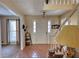 Bright foyer with tile flooring, staircase, and view into adjacent rooms at 744 Hampton Locust Grove Rd, Hampton, GA 30228