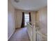 Hallway with a back door and white railing at 744 Hampton Locust Grove Rd, Hampton, GA 30228