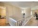 Hallway with stairs and white railing leading to other rooms at 744 Hampton Locust Grove Rd, Hampton, GA 30228