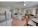 Open kitchen with white cabinetry, tile floors, and seamless transition to living spaces at 744 Hampton Locust Grove Rd, Hampton, GA 30228