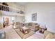 Cozy living room features neutral tones, comfortable seating, and view of the second floor at 744 Hampton Locust Grove Rd, Hampton, GA 30228
