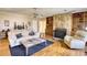 Charming living room with a stone fireplace and custom built-in shelving at 744 Hampton Locust Grove Rd, Hampton, GA 30228