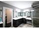 Gorgeous bathroom with double vanities, a large mirror and a glass-enclosed shower at 1365 Willis Lake Dr, Kennesaw, GA 30152