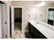 Bathroom vanity area featuring modern fixtures, a sleek countertop, and ample cabinet space at 1365 Willis Lake Dr, Kennesaw, GA 30152
