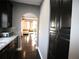 Modern kitchen with stainless steel appliances and granite countertops flowing into the living room at 1365 Willis Lake Dr, Kennesaw, GA 30152