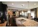 Open-concept kitchen with a granite island, stainless steel appliances, and hardwood floors at 1365 Willis Lake Dr, Kennesaw, GA 30152