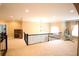 Bright loft area with carpeting, a built-in desk, chandelier and a hanging egg chair at 1365 Willis Lake Dr, Kennesaw, GA 30152