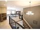 Bright, open loft area with hardwood floors, built-in shelving, and decorative lighting at 1365 Willis Lake Dr, Kennesaw, GA 30152