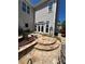 Flagstone patio with stone bench, lush greenery, and convenient access to the house at 1580 Reids Ferry Way, Marietta, GA 30062