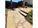 Elevated flagstone patio with dining set and lush landscaping along the back of the home at 1580 Reids Ferry Way, Marietta, GA 30062