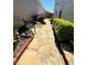 Serene flagstone walkway leads to a patio with dining area and lush greenery at 1580 Reids Ferry Way, Marietta, GA 30062