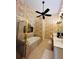 Spacious bathroom featuring a soaking tub, stand up shower, and large vanity with a chair at 1580 Reids Ferry Way, Marietta, GA 30062