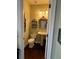 Charming powder room featuring a pedestal sink, decorative mirror, and elegant fixtures at 1580 Reids Ferry Way, Marietta, GA 30062