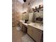 Elegant bathroom with dual vanities, large mirror, and decorative wallpaper at 1580 Reids Ferry Way, Marietta, GA 30062