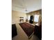 Spacious bedroom with a ceiling fan, area rug, and multiple windows for natural light at 1580 Reids Ferry Way, Marietta, GA 30062
