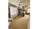 Bonus room featuring built-in bookshelves, a window seat, ceiling fan, and sloped ceiling at 1580 Reids Ferry Way, Marietta, GA 30062