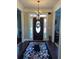 Elegant foyer with dark wood floors and a decorative chandelier at 1580 Reids Ferry Way, Marietta, GA 30062