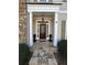 Inviting front entrance with a decorative wreath and stone walkway at 1580 Reids Ferry Way, Marietta, GA 30062