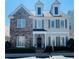 Charming two-story home featuring stone accents, gray shutters, and manicured landscaping at 1580 Reids Ferry Way, Marietta, GA 30062