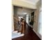 Hallway featuring hardwood floors, staircase, and views into the living area at 1580 Reids Ferry Way, Marietta, GA 30062