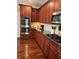 Well-maintained kitchen featuring wooden cabinets, granite countertops, and stainless steel appliances at 1580 Reids Ferry Way, Marietta, GA 30062