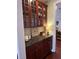 Charming buffet with wood cabinets, granite countertops, and decorative dishware at 1580 Reids Ferry Way, Marietta, GA 30062