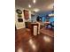 Open-concept kitchen showcases dark wood floors, granite countertops, and stainless steel dishwasher at 1580 Reids Ferry Way, Marietta, GA 30062