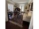 Cozy living room featuring a grand piano, plush sofa, and area rug at 1580 Reids Ferry Way, Marietta, GA 30062