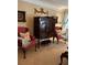 A cozy living room featuring red chairs and a beautiful armoire at 1580 Reids Ferry Way, Marietta, GA 30062