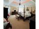 Spacious bedroom with accent lighting, four-poster bed and traditional decor at 1580 Reids Ferry Way, Marietta, GA 30062