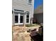 Cozy patio features flagstone, a stone bench, and access to the home through double doors at 1580 Reids Ferry Way, Marietta, GA 30062