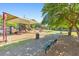 A playground with a shade covering, slides, a bench, and a path at 1580 Reids Ferry Way, Marietta, GA 30062