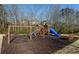 Community playground with swings, slides, and climbing structures set on a mulch surface at 1580 Reids Ferry Way, Marietta, GA 30062