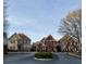 Gated community entrance featuring well-manicured landscaping and stately homes at 1580 Reids Ferry Way, Marietta, GA 30062
