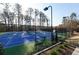 Fenced tennis court with blue and green surface with benches for relaxing after an invigorating match at 1580 Reids Ferry Way, Marietta, GA 30062