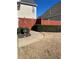 The backyard features a neatly trimmed hedge and a paved walkway leading to a decorative fence at 1580 Reids Ferry Way, Marietta, GA 30062