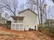 Back of home showcasing an elevated deck, white siding, lattice, and well-maintained AC units at 1935 Wenton Pl, Lawrenceville, GA 30044