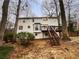 Back exterior of home with a bay window and wooden deck at 1935 Wenton Pl, Lawrenceville, GA 30044