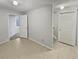 Basement with neutral tile flooring and access to other rooms at 1935 Wenton Pl, Lawrenceville, GA 30044