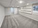 Finished basement featuring carpet and built-in storage shelves at 1935 Wenton Pl, Lawrenceville, GA 30044
